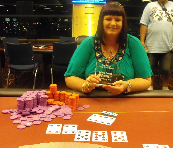 Angie Fitzgerald playing and with her trophy